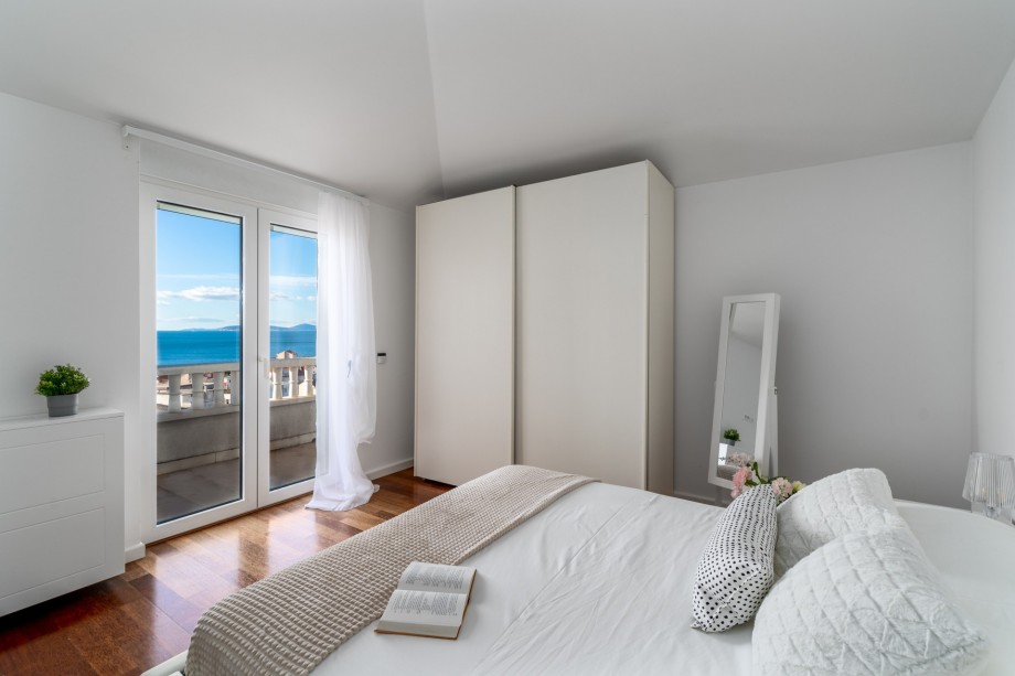 Bedroom No4 with a Queen size bed, AC, and a balcony with sea views