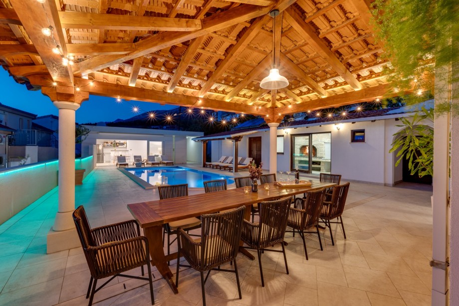 Covered outdoor dining area for 10 people with sunset view