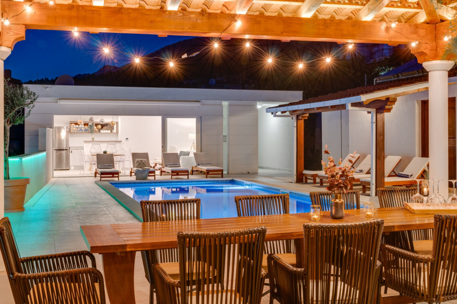 Covered outdoor dining area for 10 people with sunset view