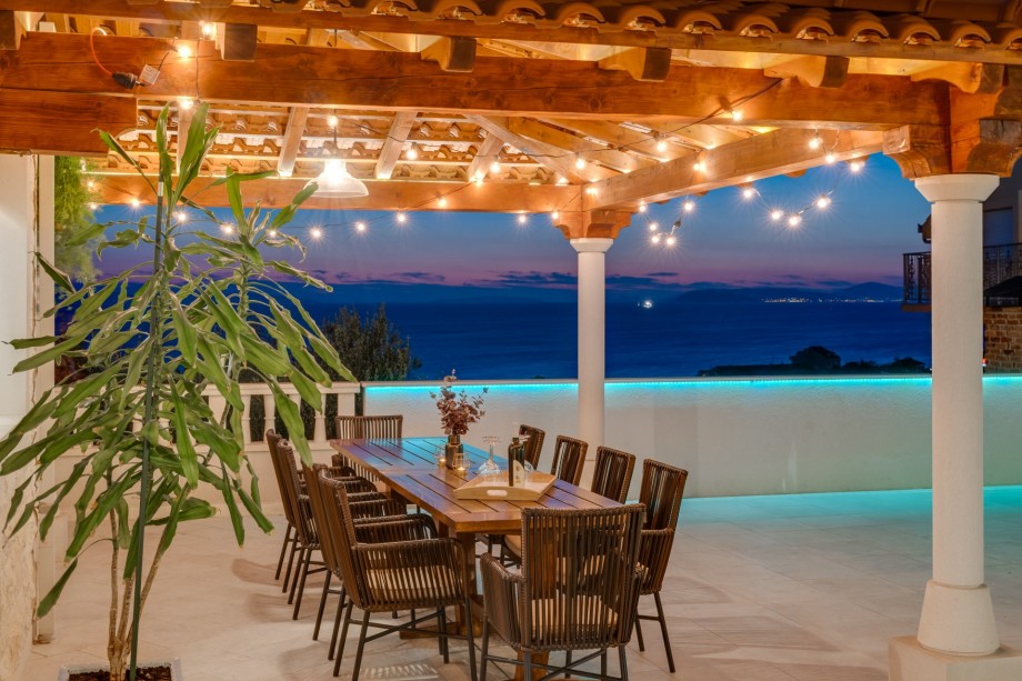 Covered outdoor dining area for 10 people with sunset view