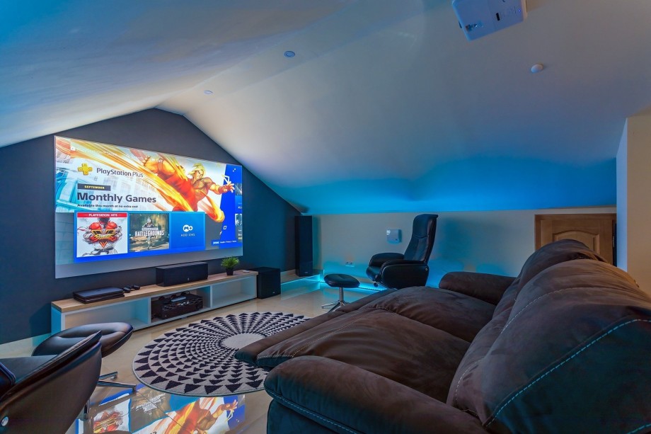 The attic offers a Cinema room with a Projector, PS4, Netflix, HBO, free WiFi, A/C, and relaxing sofas for an amazing home cinema experience.
