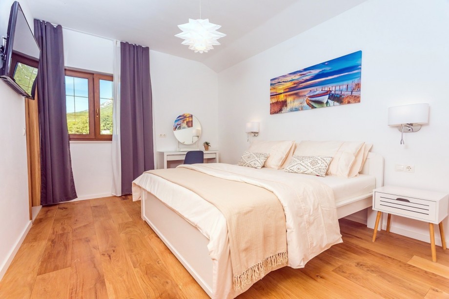 Bedroom No3 with a king size bed 180x200cm, en-suite bathroom with a shower, a TV, A/C.