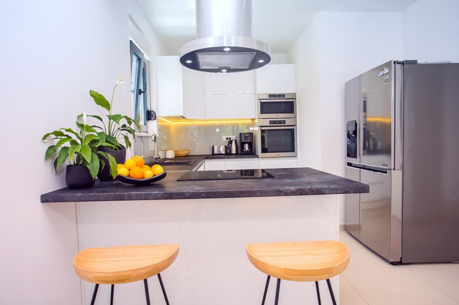 Modern fully equipped kitchen next to the dining area