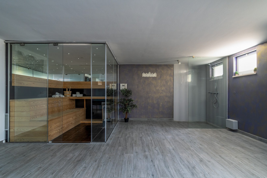 gym area and Finnish sauna, there is also a shower, a toilet & a washing machine