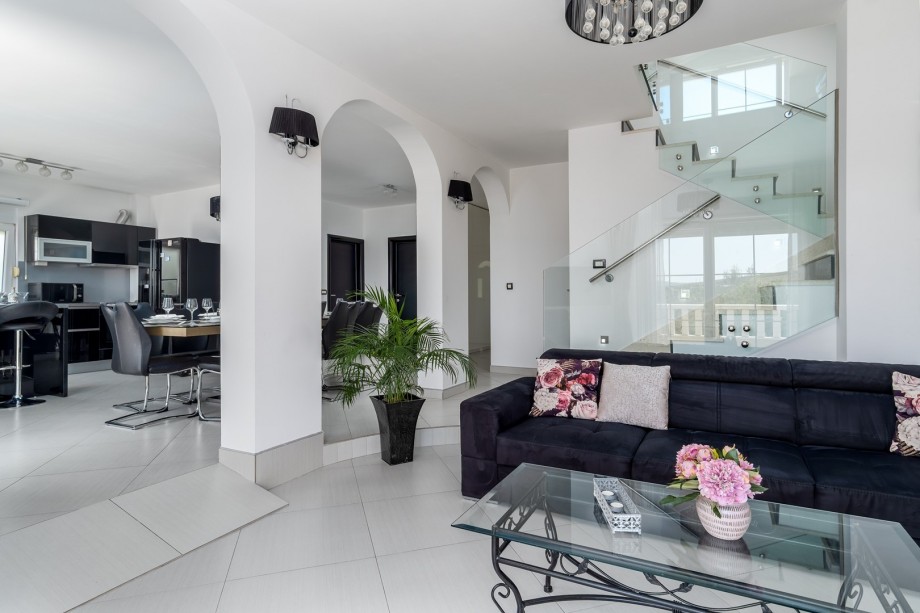 living area TV, A/C, free WiFi, exit to the terrace with pool and sea views