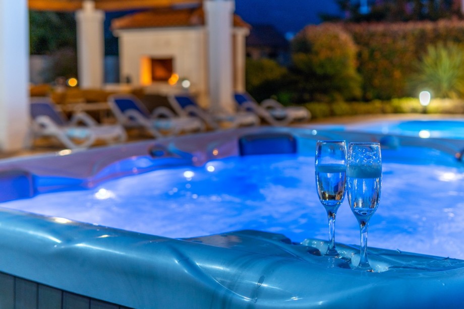 a jacuzzi near the pool and sun decks for perfect vacation