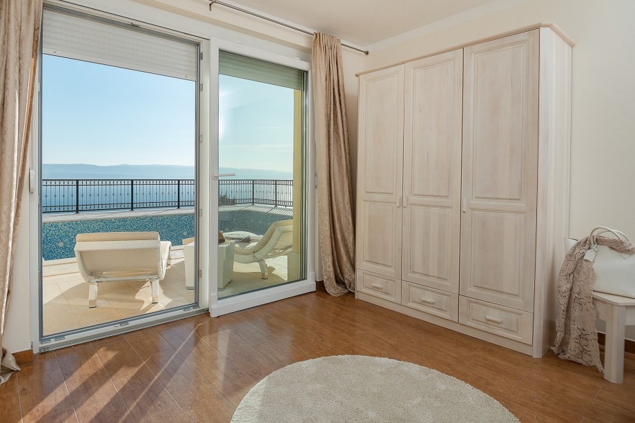 Bedroom No3 with super king-size bed 200cm x 210cm, a glass wall toward pool area, A/C and an en- suite bathroom with a showe