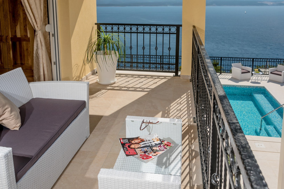 terrace  from bedroom No.5 .with pool and open sea views