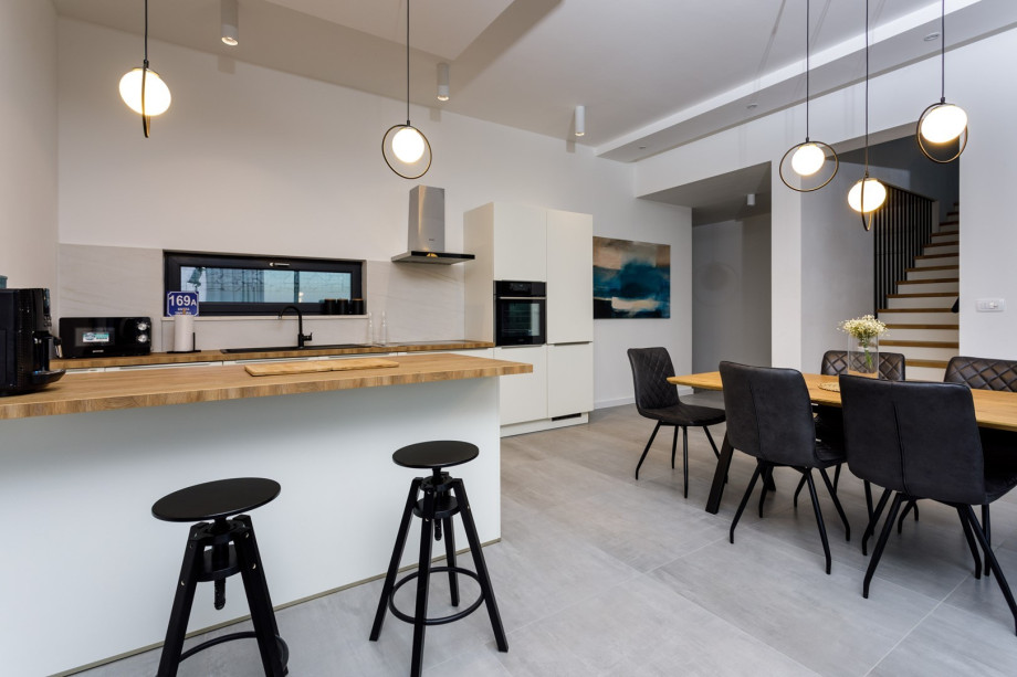 A fully equipped kitchen with all  modern guest needs (dishwasher, microwave oven, toaster, kettle, an espresso coffee machine...and more)