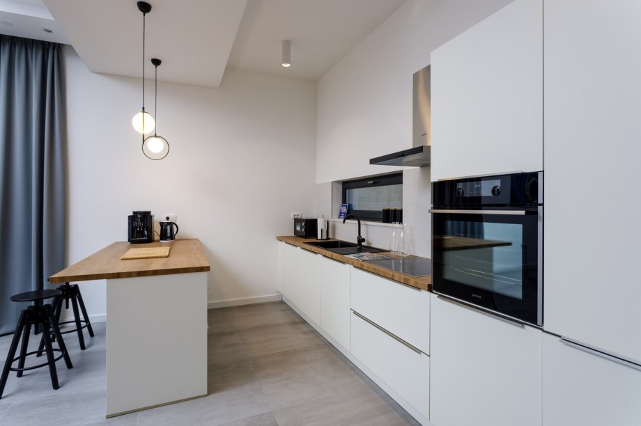 Direct approach toward outdoor dining area, an indoor dining area and a family bathroom with a shower.