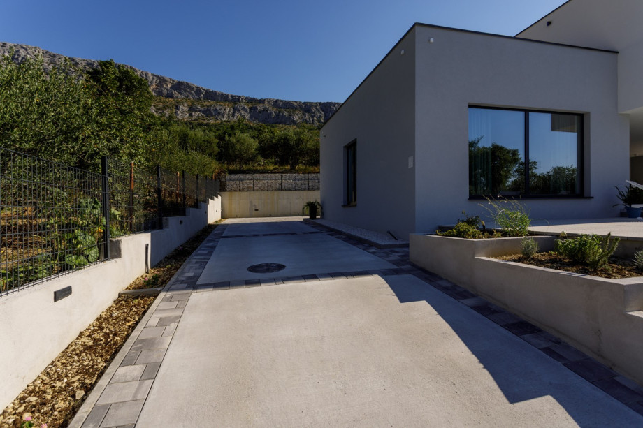 Parking lot is secured for 4 cars on a private property, fenced.