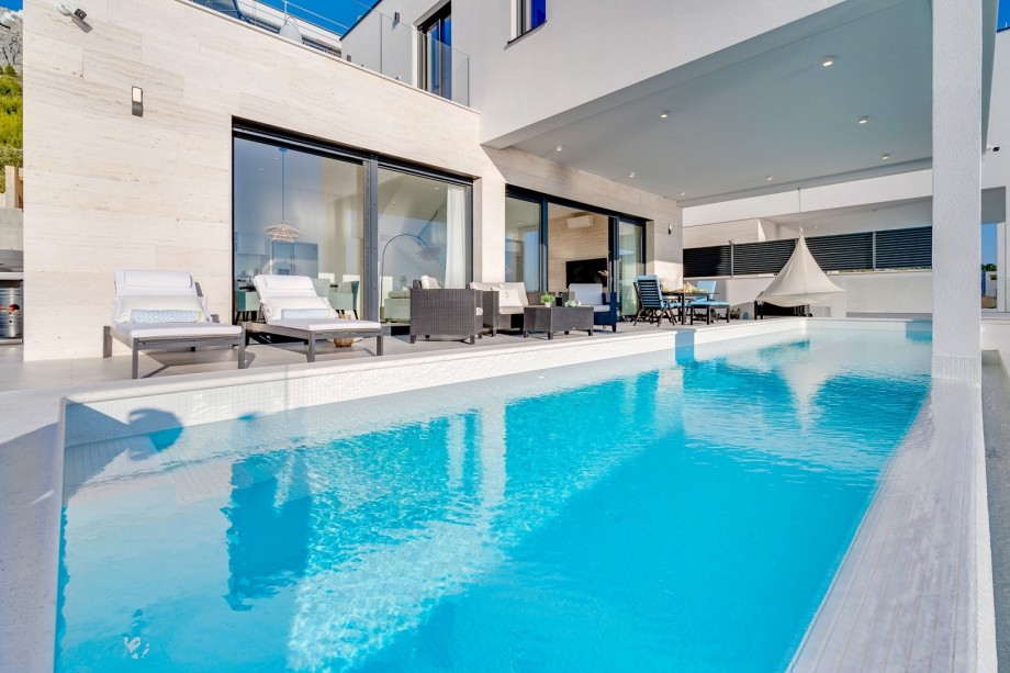 The outdoors offers a private, heated, infinity swimming pool