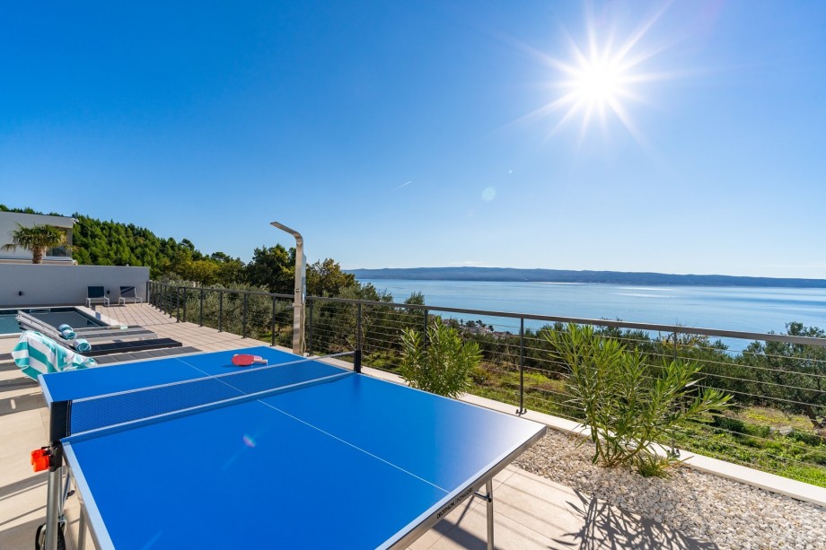Table tennis next to the pool with amazing sea view