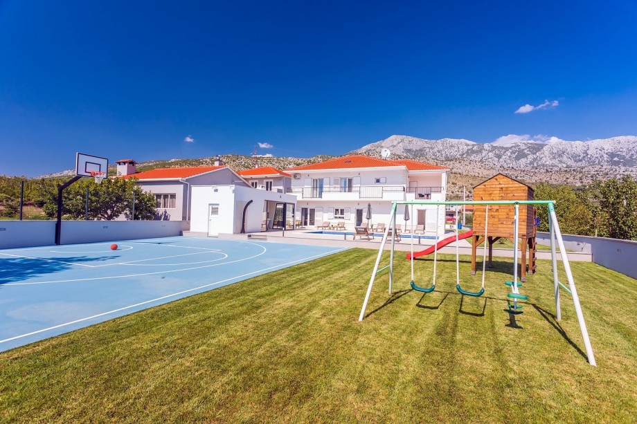 A playground for younger members of your group and offers a swing, a slide and a wooden house