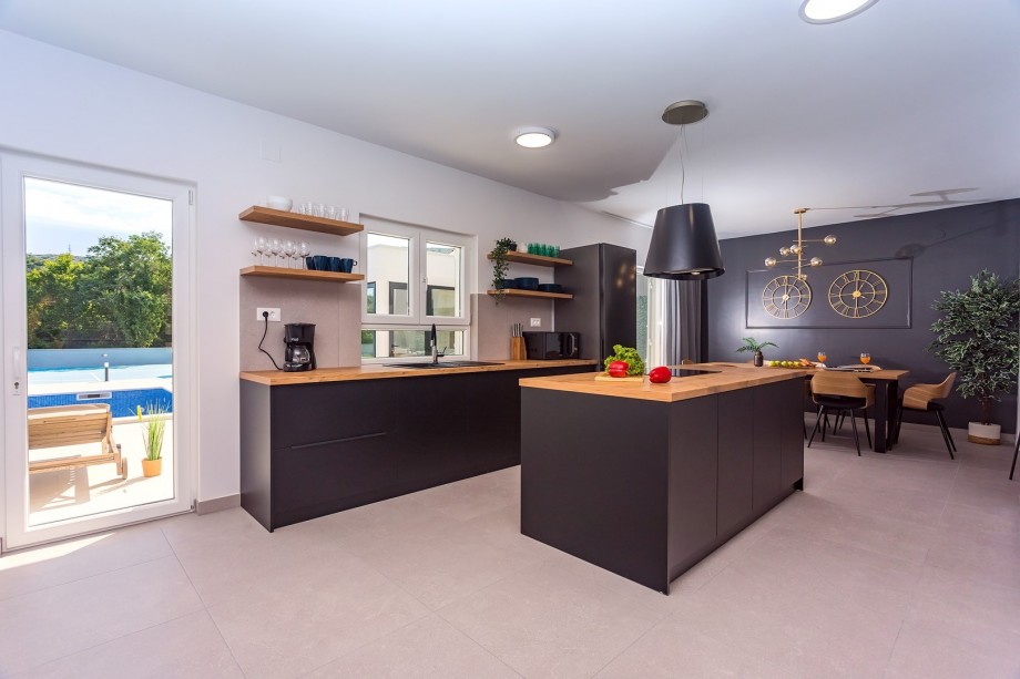 Fully equipped kitchen with pool views