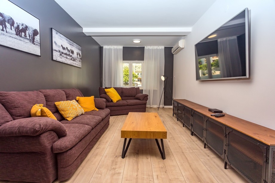 Very popular Media room on the ground floor with a comfy sofa, a huge TV and PS4