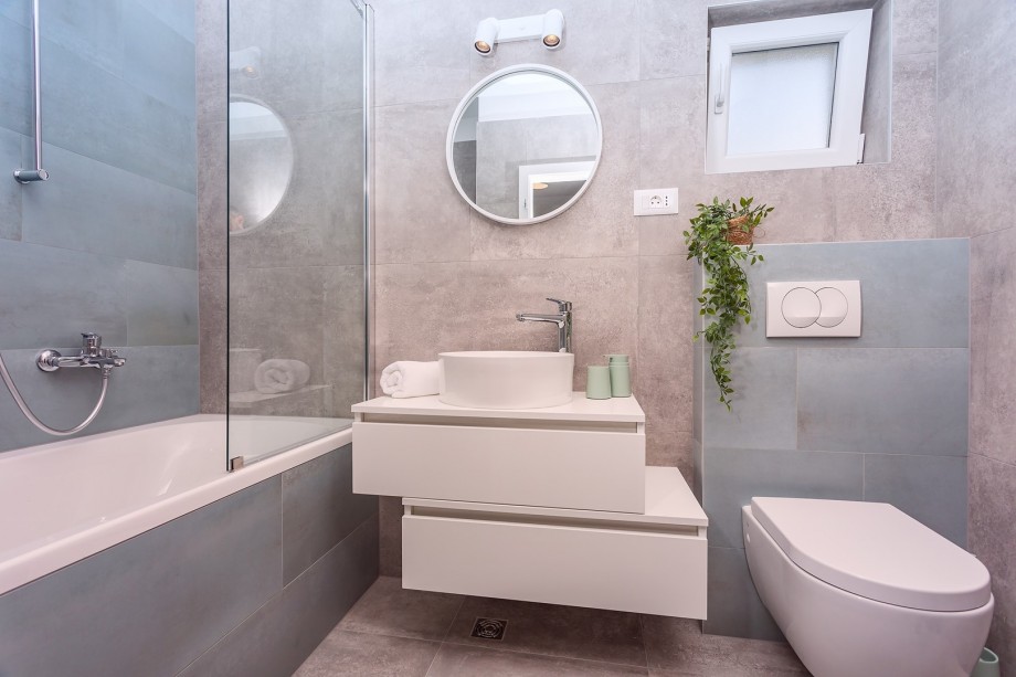 A family bathroom with a bathtub