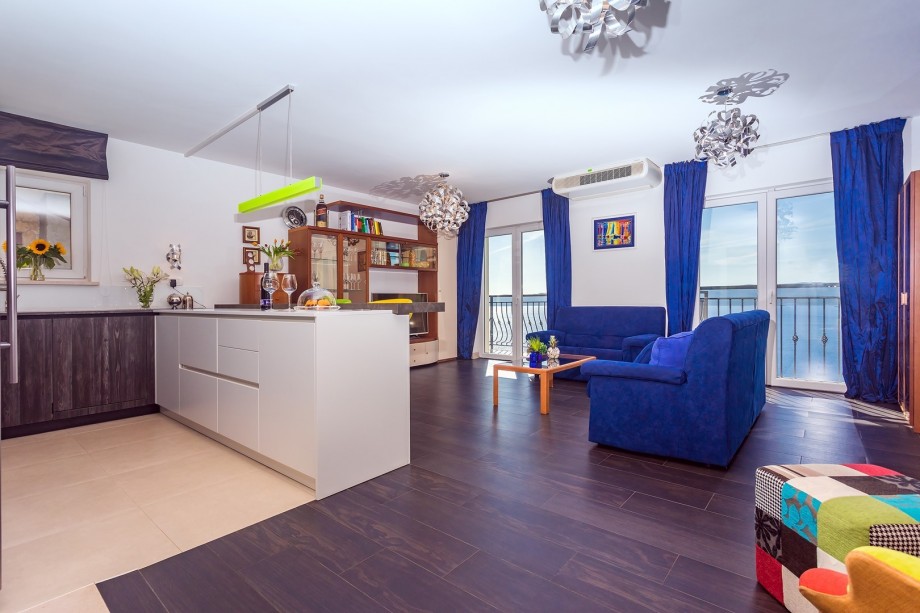 Spacious, open plan living room area with amazing seaviews