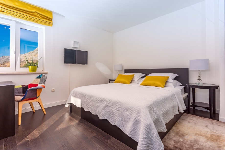 Master Bedroom No1 with king size bed 180cm x 200cm with a balcony and opened sea views.