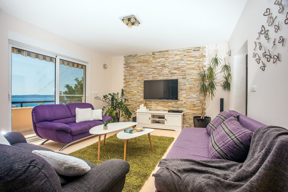 Comfortable sofas  in living area with Seaview