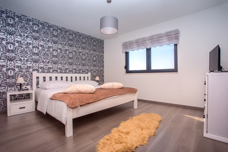 Bedroom No2 with king size bed, sofa bed for 1 person, exit to terrace with sea and pool view, A/C, TV, en-suite Bathroom No2 with shower