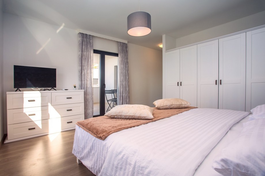 Bedroom No2 with king size bed, sofa bed for 1 person, exit to terrace with sea and pool view, A/C, TV, en-suite Bathroom No2 with shower