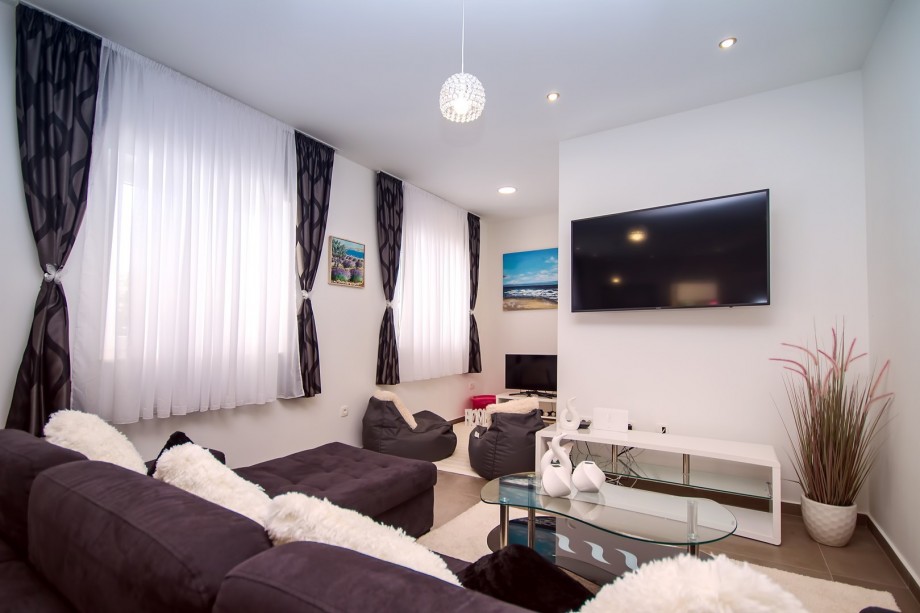 Living area with additional TV and PS, a corner for older kids :)