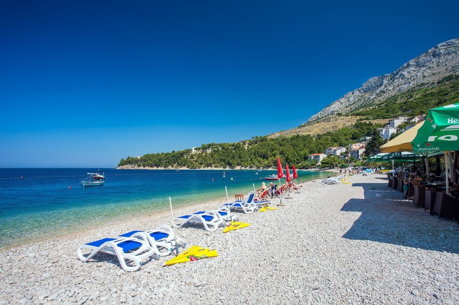 Pebble beaches in Stanići with crystal clear sea, local bars on the beach