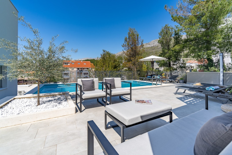 There is an additional dining table on the terrace in front of the living area