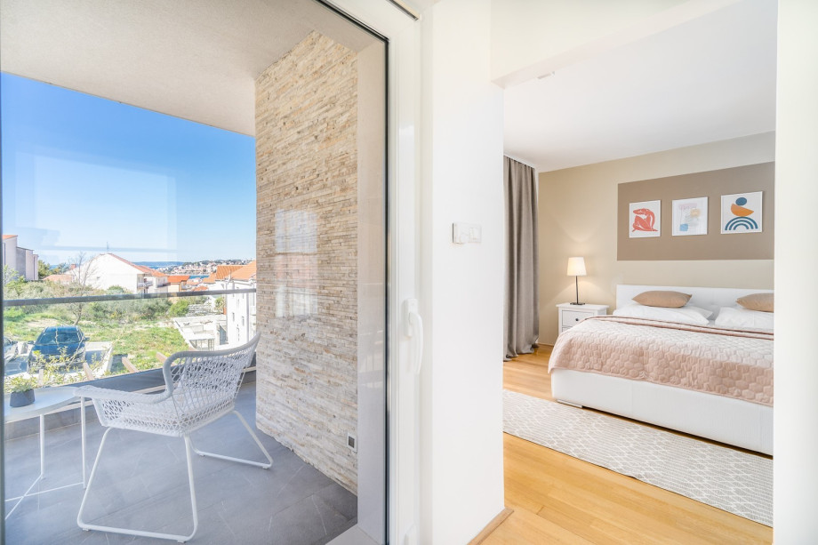 A terrace with sea views and with garden furniture.