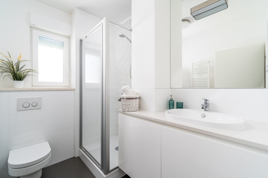 En-suite bathroom with a shower.