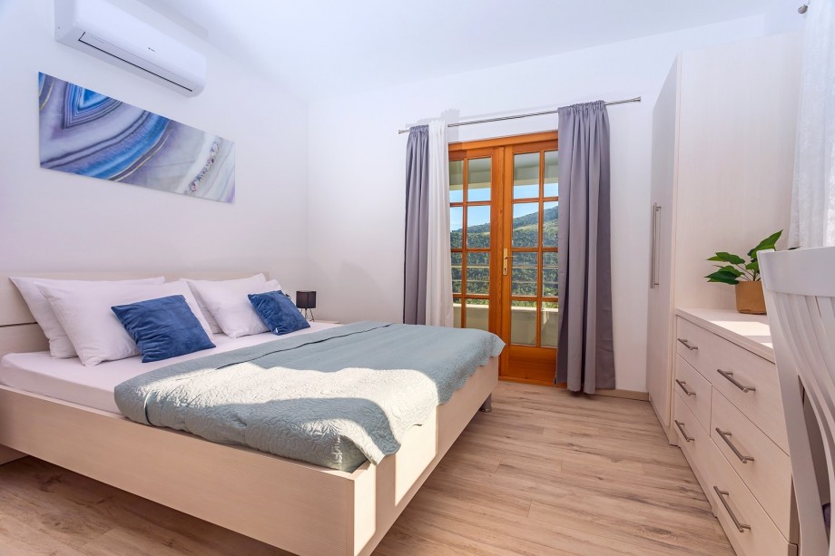 Bedroom No1 with double bed, ensuite bathroom with shower and balcony