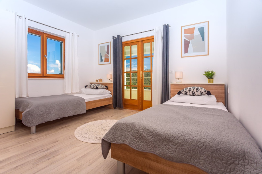 Bedroom No3 with 2 single beds + sofa bed , end exit to the terrace
