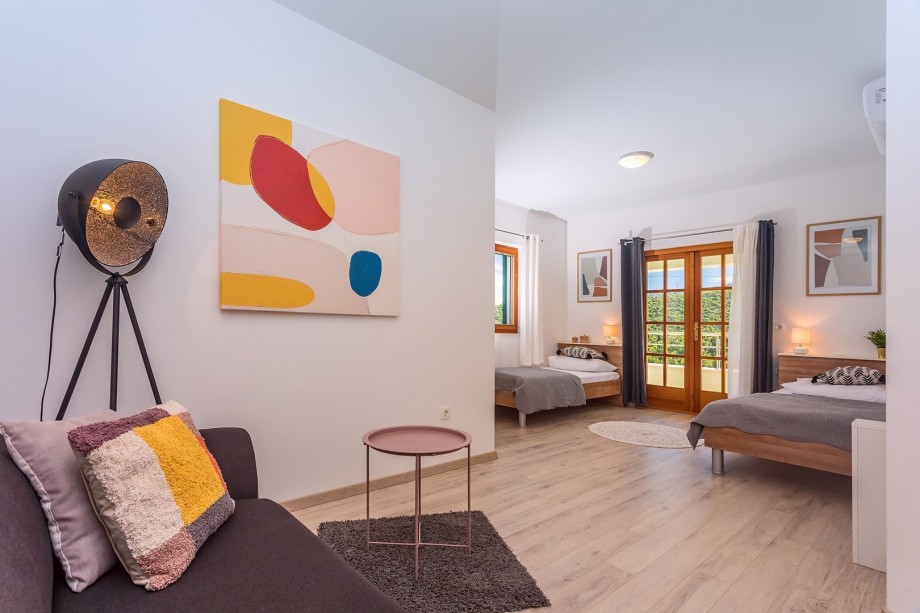 Bedroom No3 with 2 single beds + sofa bed , end exit to the terrace