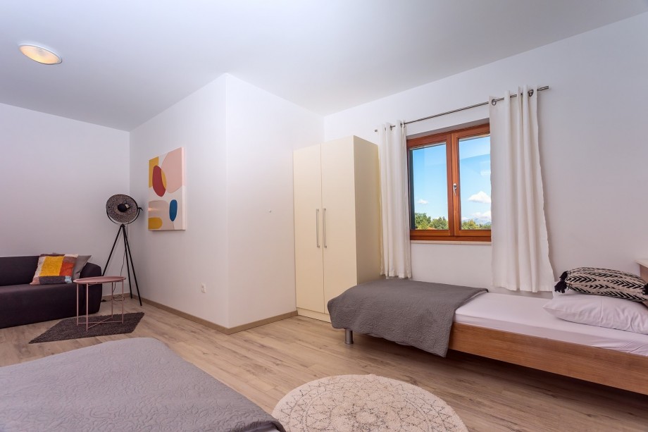 Bedroom No3 with 2 single beds + sofa bed , end exit to the terrace