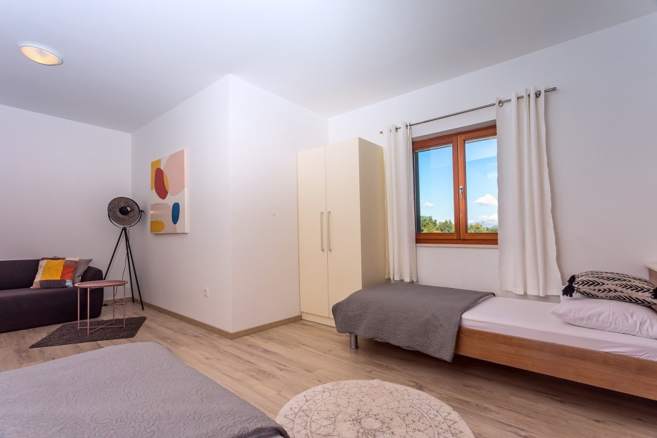 Bedroom No3 with 2 single beds + sofa bed , end exit to the terrace