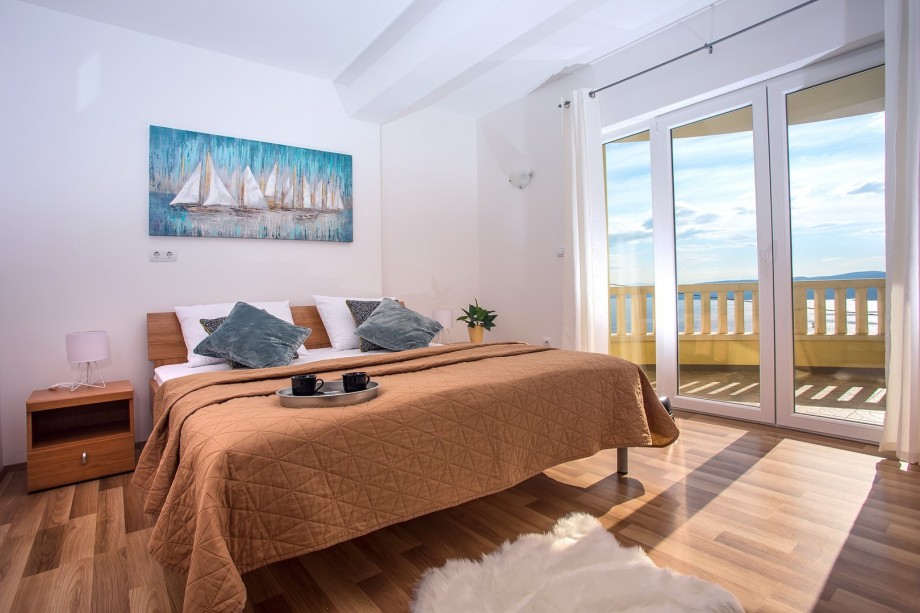 Bedroom NO1 with double bed and exit on the terrace with a sea view, 1st floor