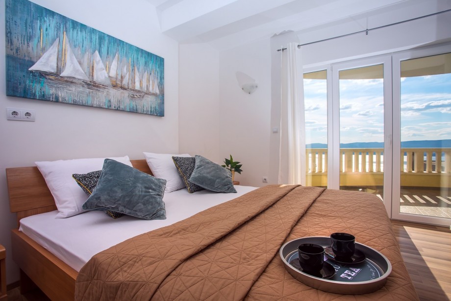 Bedroom NO1 with double bed and exit on the terrace with a sea view, 1st floor