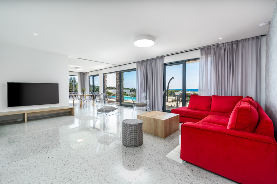 Living room is very light and stylish, offering a comfortable sofa.