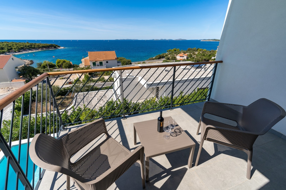 A balcony with outdoor furniture