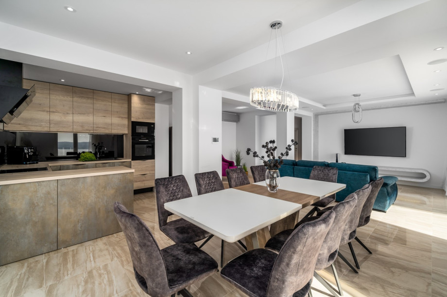 A spacious dining area with open and panoramic views of the Adriatic sea, islands and direct approach to the pool area.