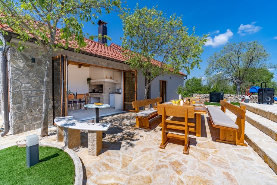 A dining area for 16 people and a summer kitchen (25sqm) with traditional barbecue