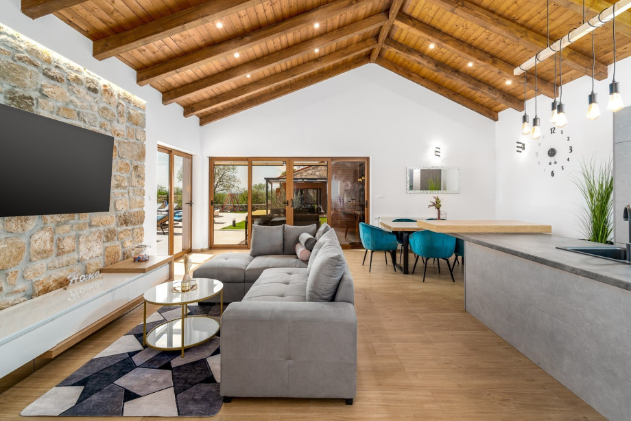 A spacious living room with A/C, TV, sofa (can convert into a sofa bed)