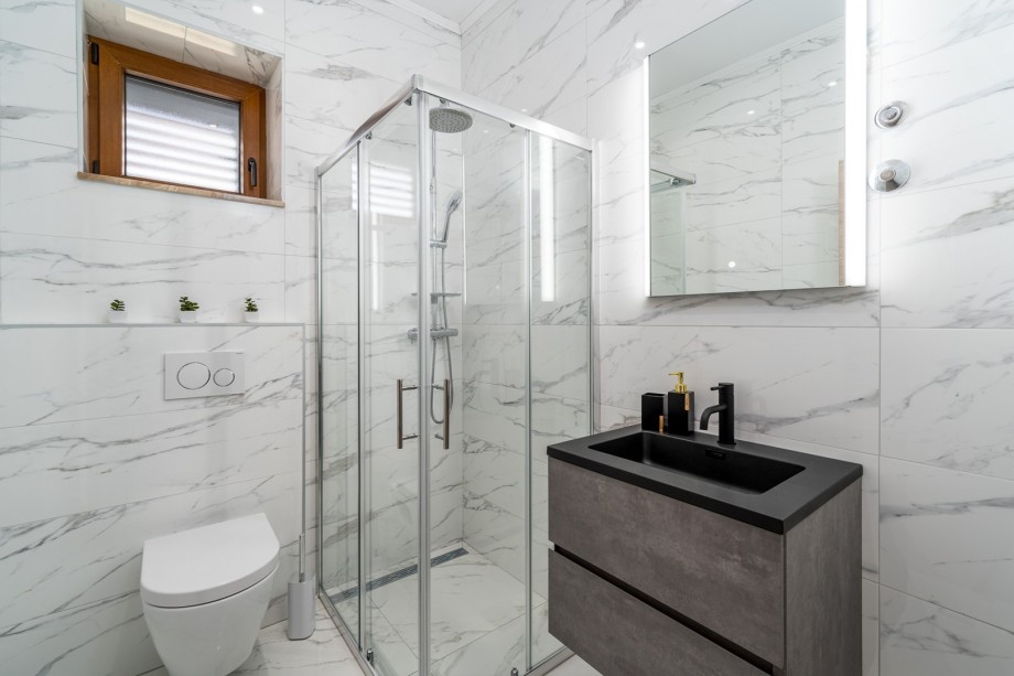 Family bathroom with a shower and a toilet.