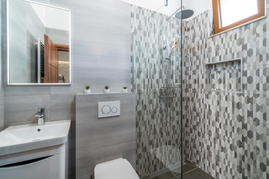 A Family bathroom with a shower.
