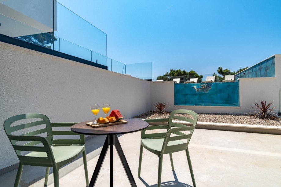 Bedroom No1 offers an exit to a terrace with a table for two