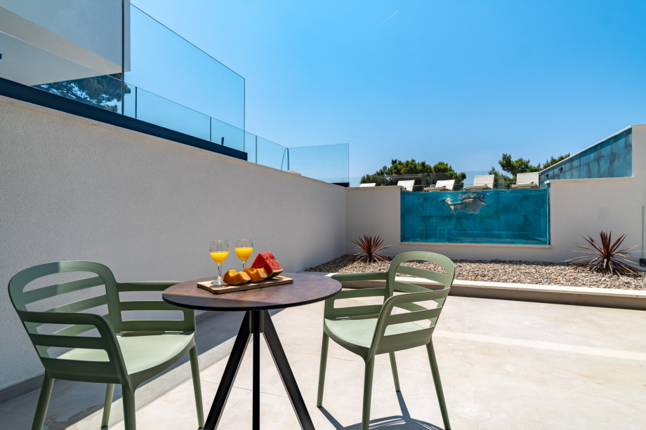 Bedroom No1 offers an exit to a terrace with a table for two