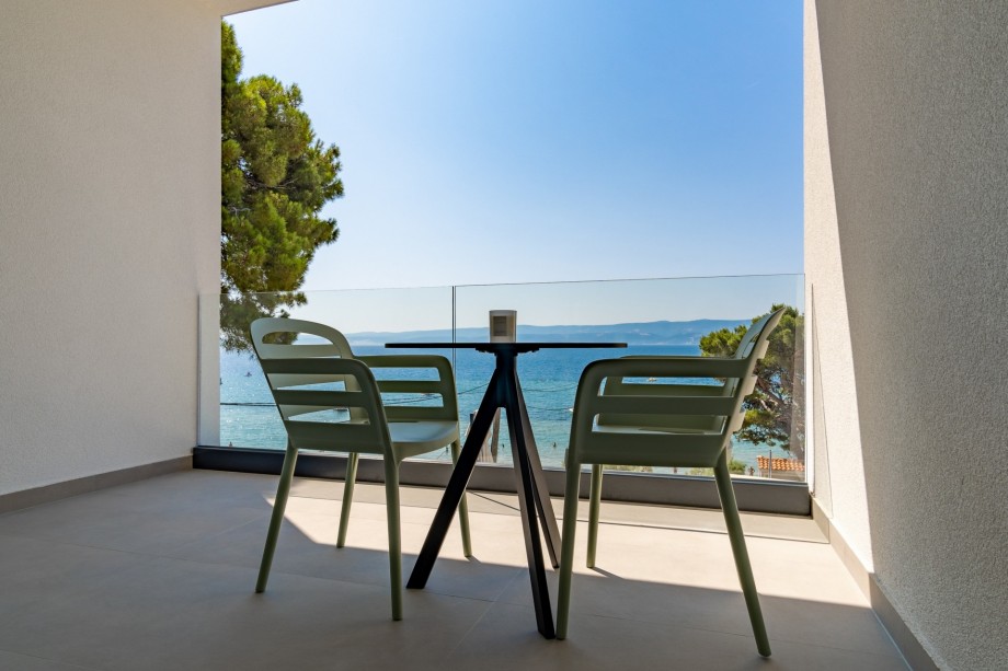 Bedroom No4 offers an exit to a terrace with a table for two