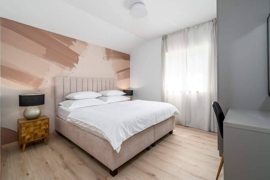 On the second floor  is a Bedroom NO1 (15sqm) with king size bed 180cm x 200cm, A/C.