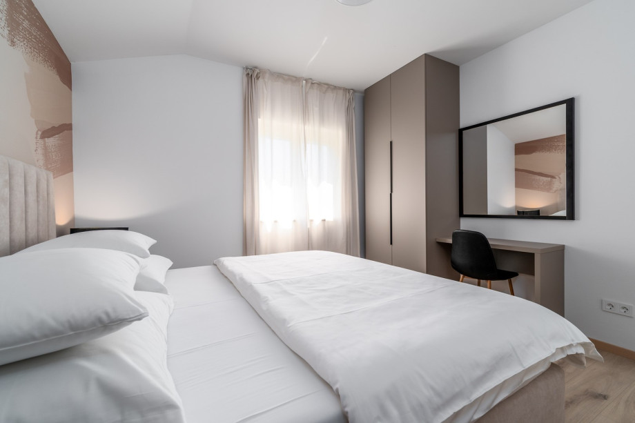 On the second floor  is a Bedroom NO1 (15sqm) with king size bed 180cm x 200cm, A/C.
